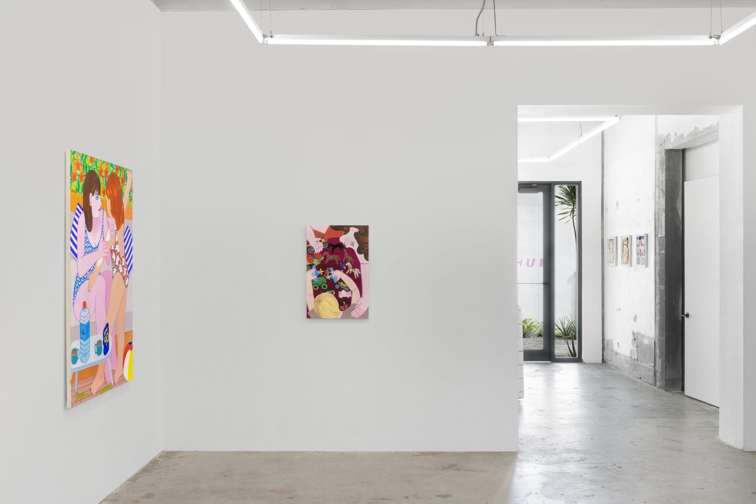 Installation view of Madeline Donahue: Present Tense on view in the Front Gallery. Photographed are oil on canvas paintings titled "Toys" and "Sunscreen."